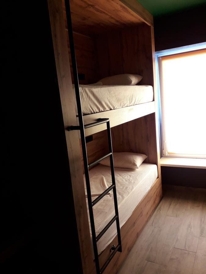 Full House Capsule Hostel Rivne Ngoại thất bức ảnh A bunk bed with a ladder